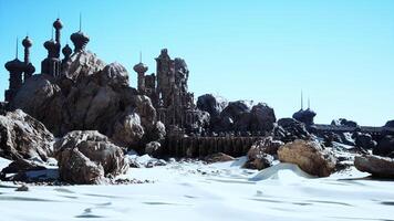 A large stone building with many spires on top of it photo