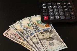 Money, US dollar bills background. Finance and Economy concepts. Money scattered on the desk. photo