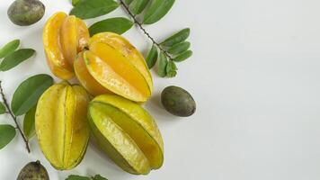 star fruit and leaves on white background photo