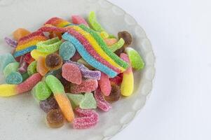 a plate with a variety of colorful candy on it photo