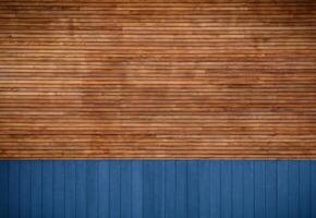 blue metal siding and wooden boards on the facade as a background 2 photo