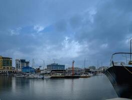 LIMASSOL, CYPRUS - APRIL 15, 2024 Old port of Limassol with beautiful fishing boats at sunset photo