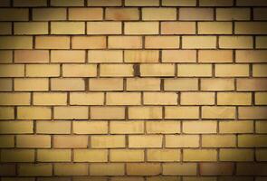 Yellow brick wall texture background, horizontal pattern photo