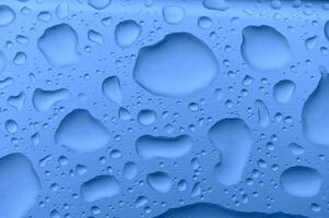 Raindrops on the window. Blue tone 3 photo