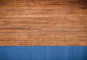blue metal siding and wooden boards on the facade as a background photo