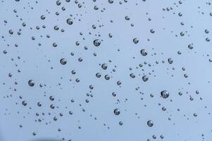 Close-up of wet windshield during rainy season 3 photo