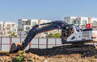 Excavator digging soil at a construction site 6 photo