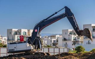 Excavator digging soil at a construction site 8 photo