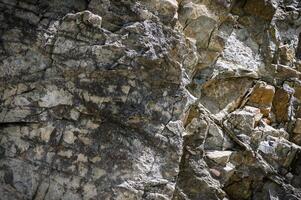 piedras textura naturaleza foto. rock antecedentes. montaña de cerca. montaña textura. 1 foto