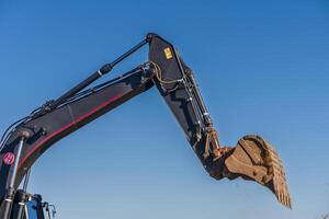 Close up details of industrial excavator working on construction site 5 photo