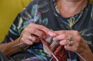 woman knits socks. knitting needles. female hands close up.2 photo