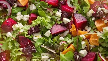 A colorful salad of mixed greens roasted beets feta cheese and a tangy vinaigrette dressing video