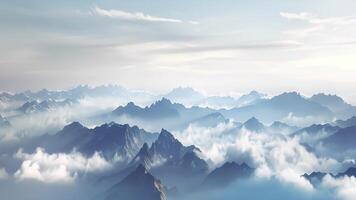 A view from above as the fog descends upon the peaks of the mountains video