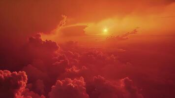 An otherworldly scene of a red sunrise peeking through pyrocumulus clouds formed by a distant wildfire video