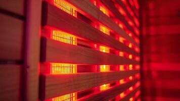 A closeup of a sauna panel demonstrating the red glow of the infrared light and its ability to trate the body for deep relaxation. video