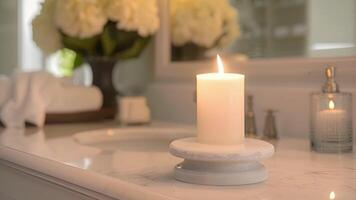 A vanilla bean candle sitting on a marble pedestal adding a touch of sophistication to a spalike bathroom video