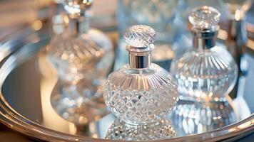 A closeup of designer perfume bottles arranged on a mirrored tray capturing the essence of luxury and sophistication video