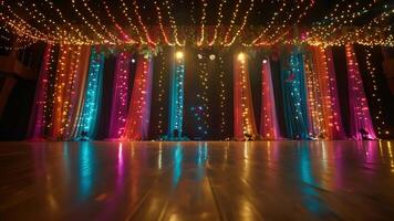 A shot of the stage decorated with ling lights and colorful streamers creating a fun and festive atmosphere video