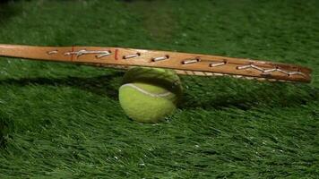 Super Slow Motion Shot of tennis ball and tennis racket at 1000 fps at natural grass during rain. Sport concept super slow motion shot on high speed camera 1000 fps. video