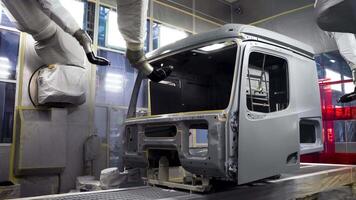 industrial background with the process of painting the car frame. Scene. View inside of a workshop with a paint spraying robots at the production of cars. video