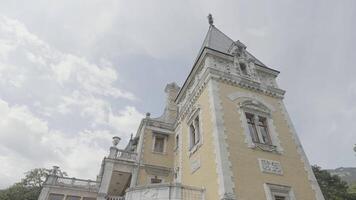 Bottom view of old country palace. Action. Beautiful architecture of country estate in style of European castles. Small European castle outside city in summer video