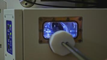 Close up of worker adjusting 3D printer at the workshop. Stock footage. Industrial background at workshop. video