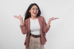 Excited Asian woman wearing eyeglasses presenting the copy space on her right and left side isolated by white background. photo