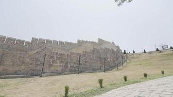 Tourist trail at ancient fortress. Action. Tourist attraction in form of medieval fortress. Medieval walls of fortress on hill video