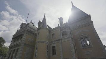 Bottom view of old country palace. Action. Beautiful architecture of country estate in style of European castles. Small European castle outside city in summer video