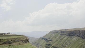 Top view of beautiful landscape of green mountains on background of sky. Action. Mountain green canyon on background of clouds and blue sky video