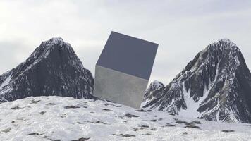 Rotating cube on background of mountains. Design. Mysterious animation of metal cube rotating on background of mountains. Cosmic metal cube rotates in air near mountains video