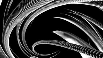 Twisted metal silver tube on a black background. Design. Metal tangle is unraveling and disappearing. video