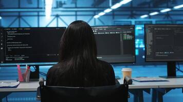 Person with paraplegia in server hub workplace doing inspection on electronics, reading files. Wheelchair user at work looking over paperwork, verifying infrastructure documents, doing audit video