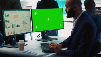 Chief financial officer reviews cost and revenue numbers next to a greenscreen, working on data management study for future improvement. Accountant ensures organizational success. Camera A. video