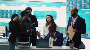 Displeased project manager sharing the failure with his team, employees feeling disappointed and frustrated about unsuccessful partnership. Furious CEO and dissatisfied associates. Camera A. video
