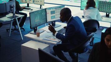 General director examining statistics big data on computer in a control room, makes a briefing report. Business manager studying sales numbers to adapt within market conditions. Camera B. video