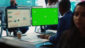 Project manager works with infographics reports and greenscreen, ensuring business objectives achievement. Male analyst studying the current financial progress, data management. Camera A. video