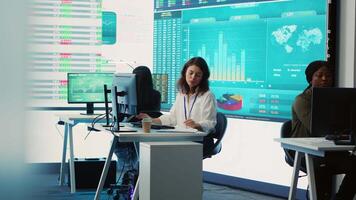 Business specialist reviewing key performance indicators within the firm activity. Conducting evaluations in order to help with global corporation expansion, enhance team efficiency. Camera A. video