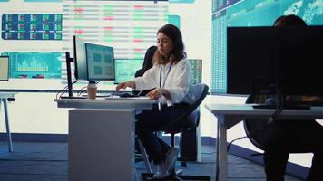 Business specialist reviewing key performance indicators within the firm activity. Conducting evaluations in order to help with global corporation expansion, enhance team efficiency. Camera B. video