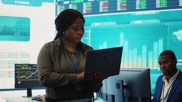 Business analyst looking into statistics and reports to detect any obstacles within the project structure, preparing solutions to ensure productivity. Manager studies numbers. Camera A. video