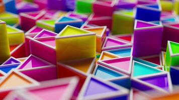 Looping animation of a group of multicolored plastic geometric shapes. video