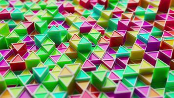 Looping animation of a group of multicolored plastic geometric shapes. video