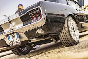 Vicenza Italy 19 March 2024 Sparkling vintage American car parked at an automotive show gathering photo