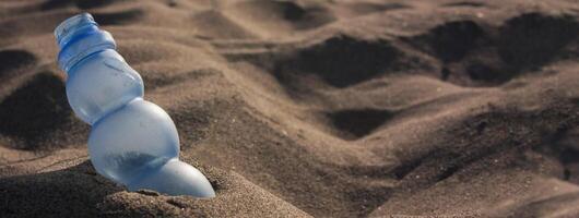 Plastic pollutes beach photo