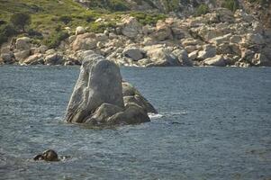 The rock that comes out of the sea. photo