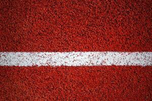 White line on a surface of running track as texture, background, vignette photo