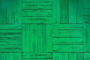 Painted green wooden wall planks as texture, background photo