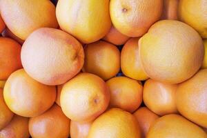 A pile of grapefruit as background photo