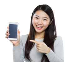 Happy woman pointing at a smartphone with a blank screen, wearing a light grey top png