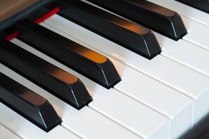 Piano keys side view with warm light photo